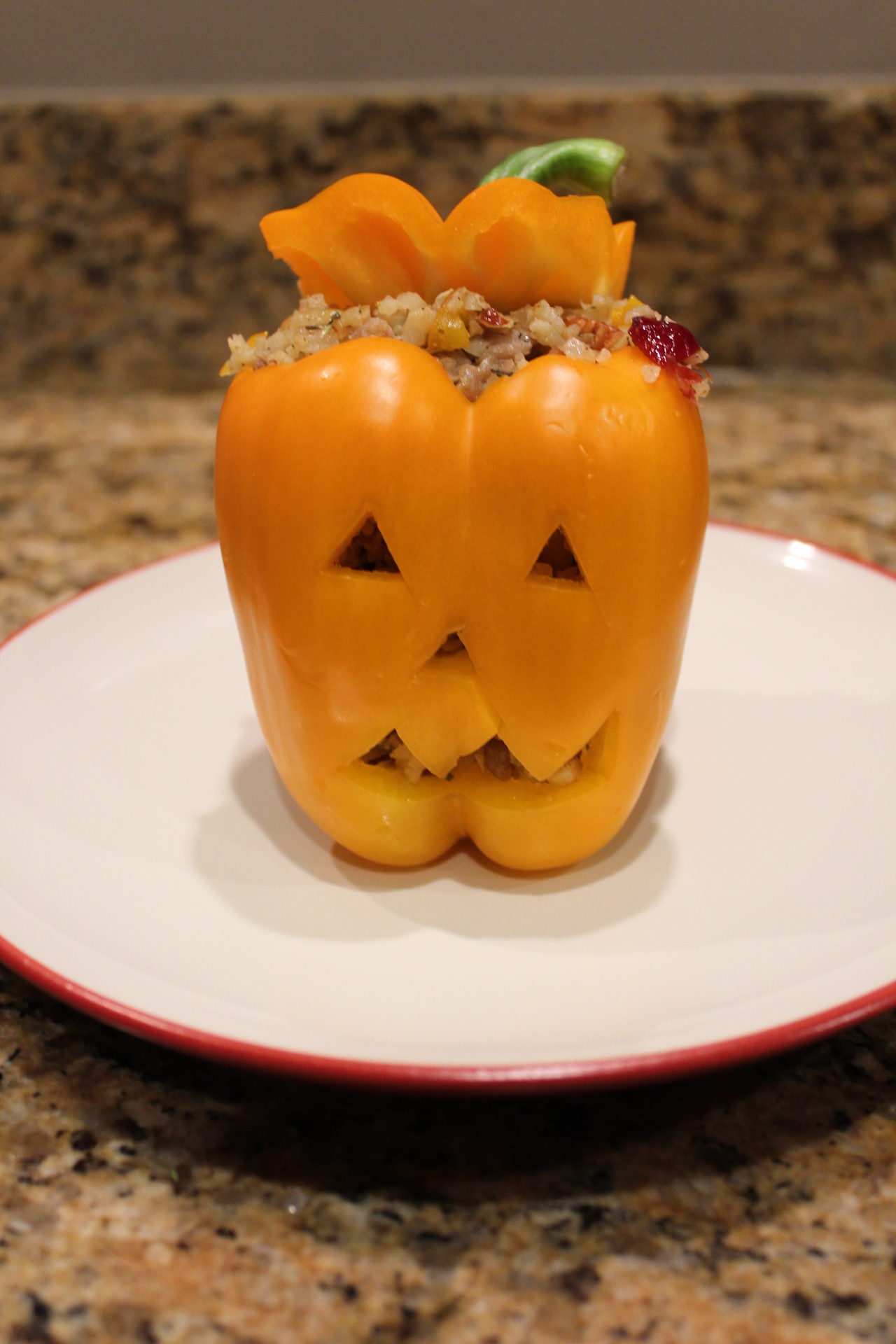 Halloween jack-o-lantern stuffed peppers