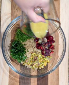 Pour the dressing over the quinoa salad